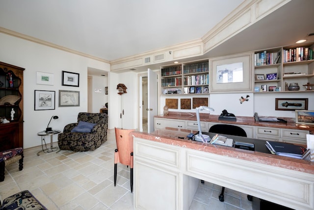 office featuring built in desk and crown molding