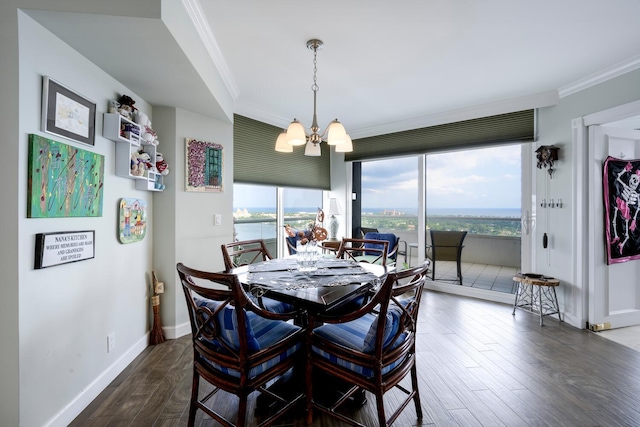 dining area with ornamental molding, a notable chandelier, dark hardwood / wood-style floors, and a healthy amount of sunlight