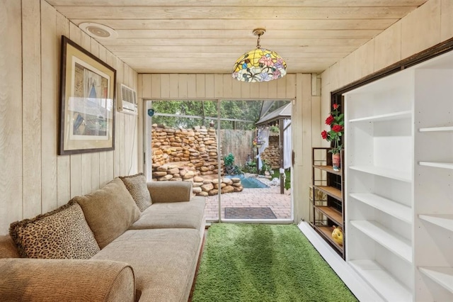 sunroom / solarium with a wall unit AC and wooden ceiling