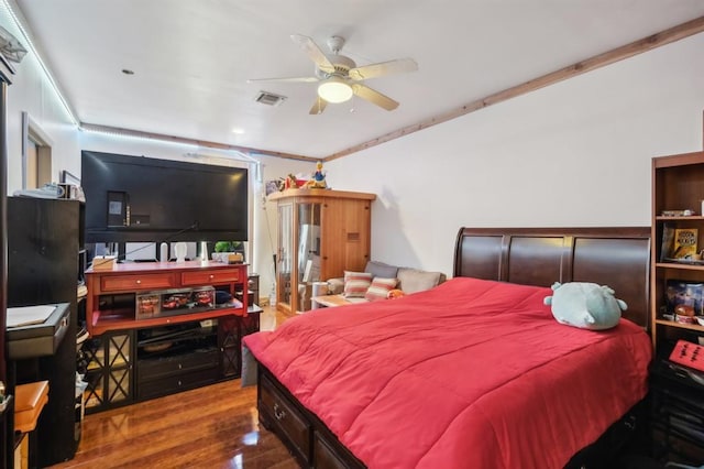 bedroom featuring ornamental molding, ceiling fan, and hardwood / wood-style floors