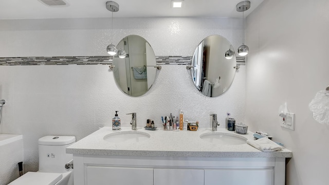 bathroom with vanity and toilet