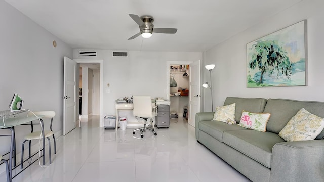 living room featuring ceiling fan and light tile patterned floors