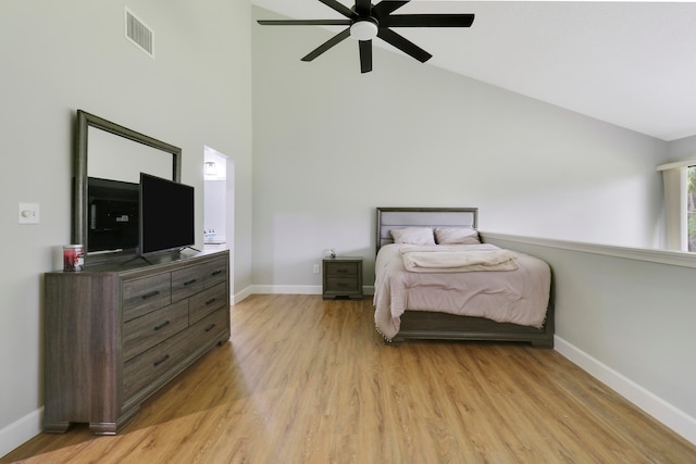 bedroom featuring high vaulted ceiling, ceiling fan, and light hardwood / wood-style flooring