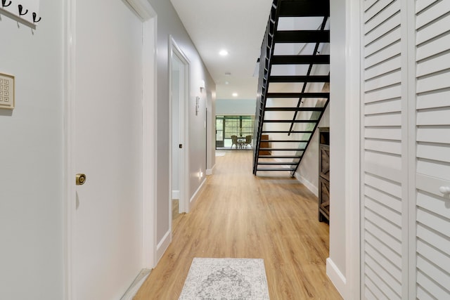 hall with light wood-type flooring