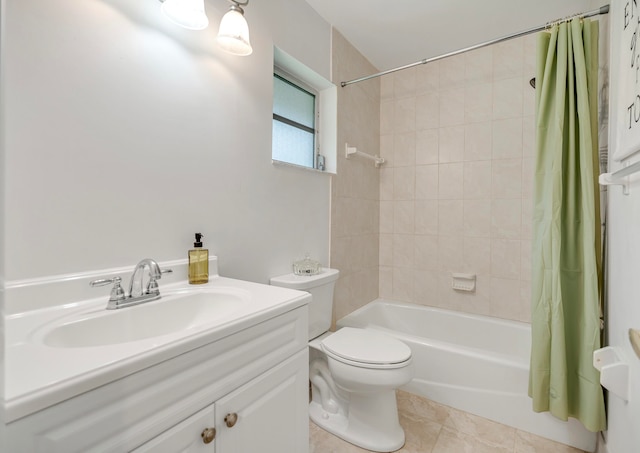 full bathroom featuring tile patterned flooring, vanity, toilet, and shower / bathtub combination with curtain