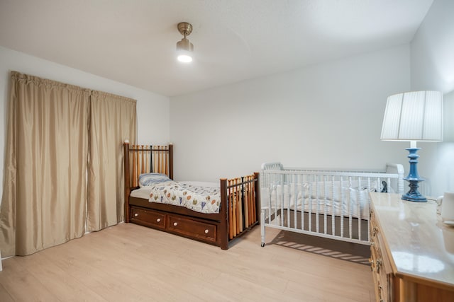 bedroom featuring light wood-type flooring