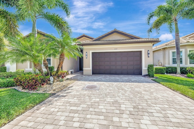 view of front of house featuring a front yard and a garage