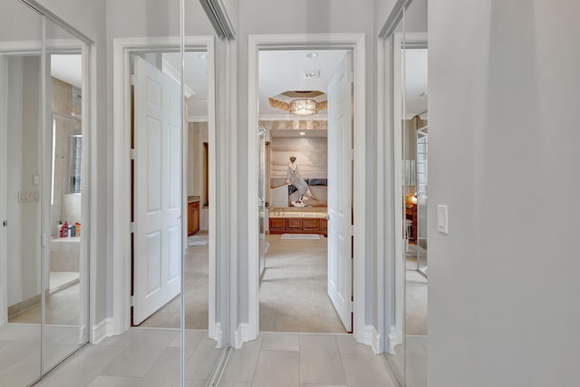 hallway featuring light tile patterned floors