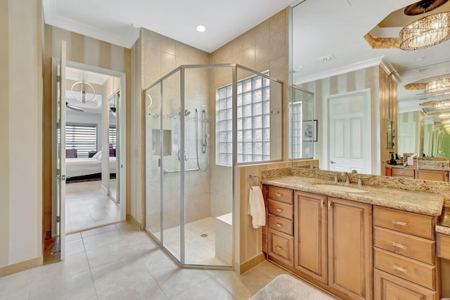 bathroom with vanity, ornamental molding, an enclosed shower, a chandelier, and tile patterned flooring