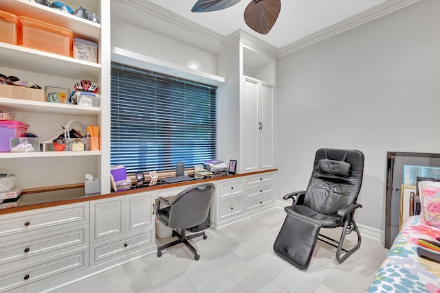 office area featuring ceiling fan, light tile patterned floors, built in desk, and ornamental molding