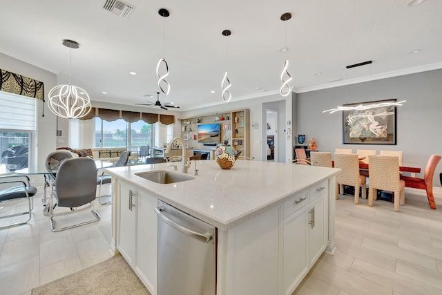 kitchen featuring pendant lighting, sink, dishwasher, an island with sink, and white cabinetry