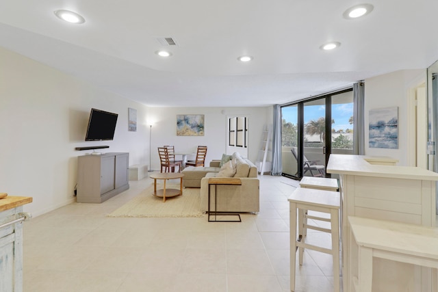 living room with light tile patterned floors