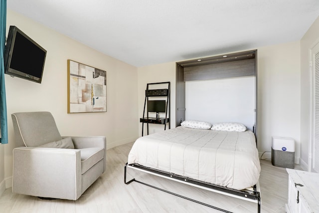 bedroom with light hardwood / wood-style flooring