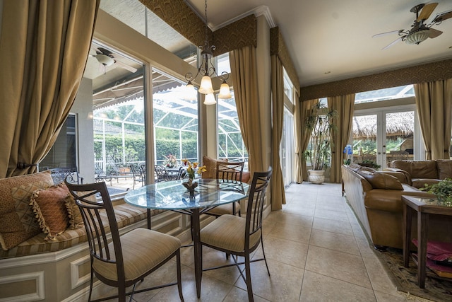 dining room with ceiling fan, light tile patterned floors, a wealth of natural light, and french doors