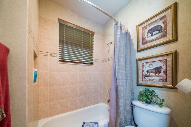 bathroom with toilet and shower / bathtub combination with curtain