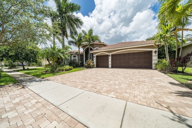 mediterranean / spanish-style home featuring a garage