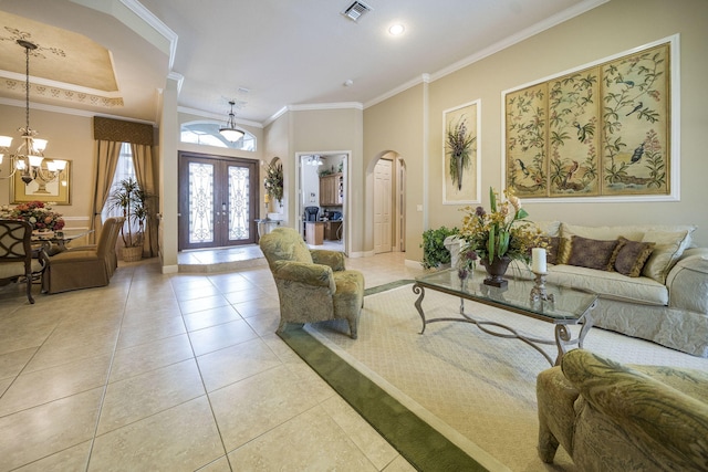 interior space featuring a notable chandelier, crown molding, and french doors