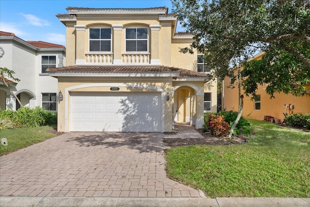 mediterranean / spanish-style house with a garage