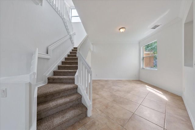 stairway featuring tile patterned floors