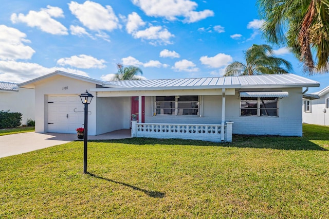 single story home with a porch, a garage, and a front lawn