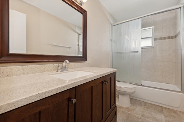 full bathroom featuring shower / bath combination with glass door, vanity, and toilet