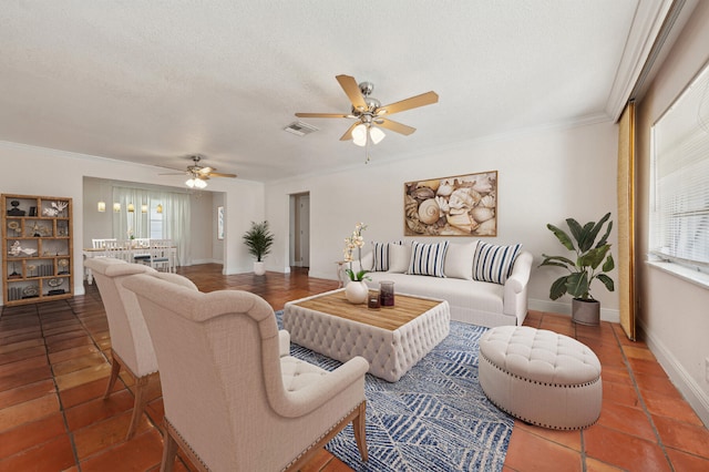 tiled living room with a textured ceiling, plenty of natural light, and ornamental molding