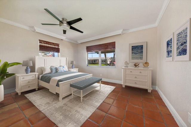 bedroom with ceiling fan, dark tile patterned floors, and ornamental molding