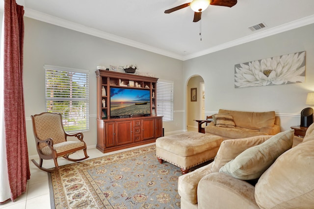 living room with ornamental molding, ceiling fan, and light tile patterned floors