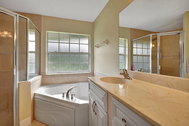 bathroom with plus walk in shower and vanity