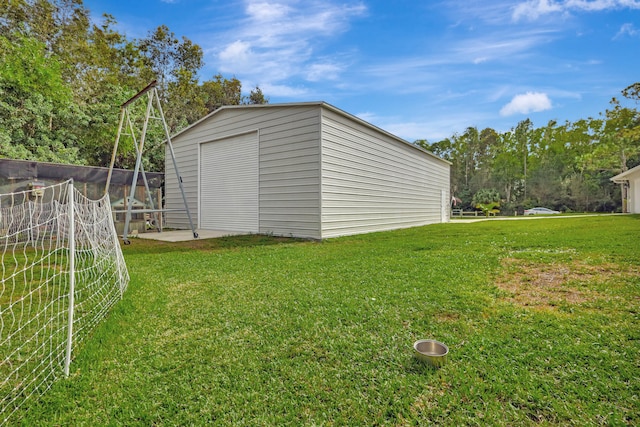 view of outdoor structure with a yard