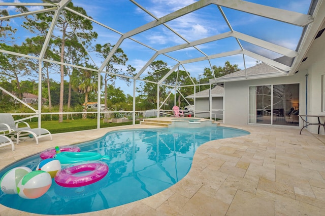 view of pool with an in ground hot tub, a patio, and a lanai