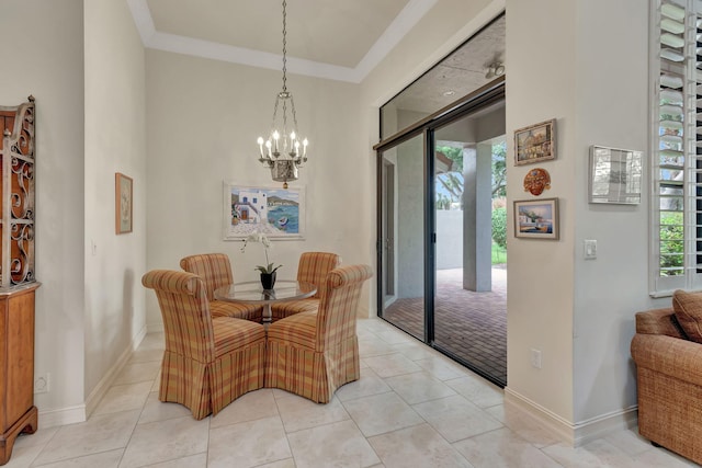 tiled dining space featuring crown molding and an inviting chandelier