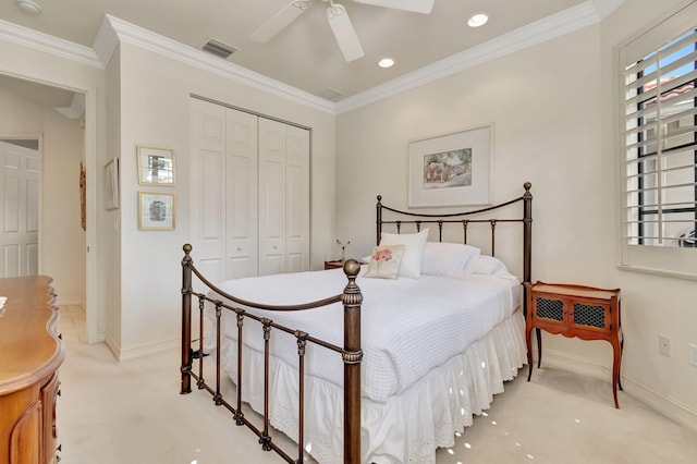 bedroom with ceiling fan, a closet, light carpet, and ornamental molding