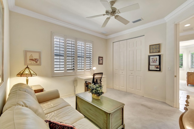 living room featuring ceiling fan, light colored carpet, and crown molding