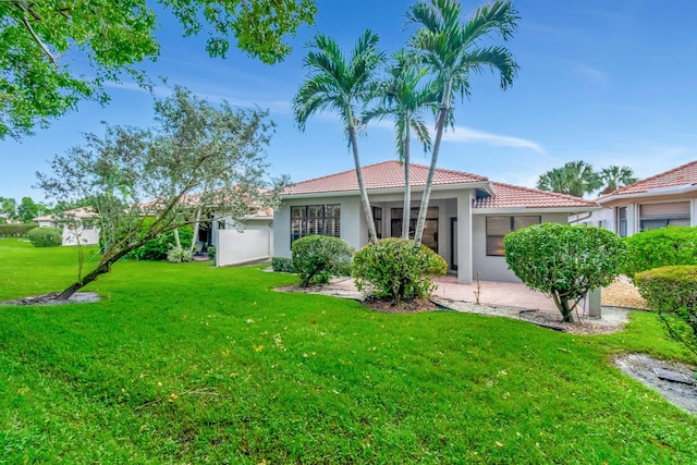 rear view of property with a yard