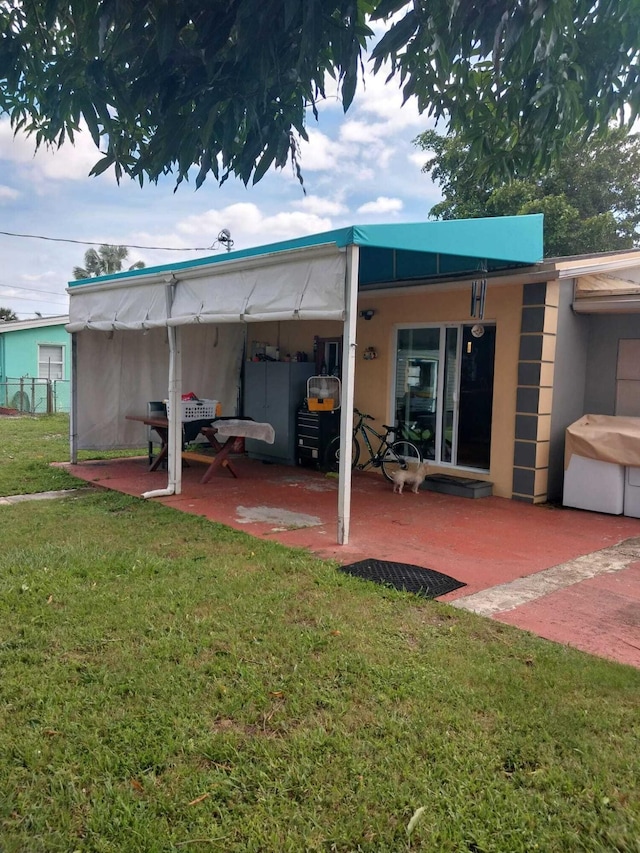 exterior space featuring a patio and a yard