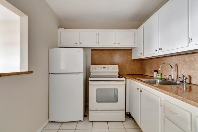 kitchen featuring sink, white appliances, white cabinetry, and light tile patterned floors