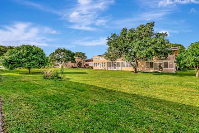 view of yard with a sunroom