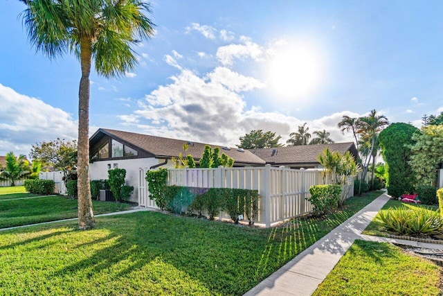 view of side of property featuring a lawn