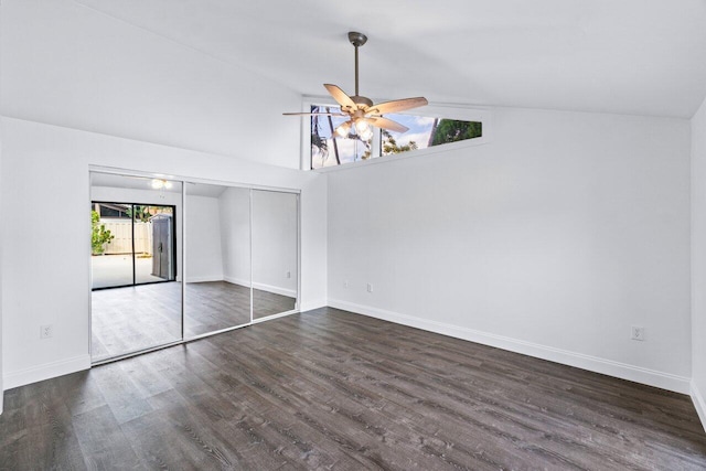 interior space featuring ceiling fan, lofted ceiling, dark hardwood / wood-style flooring, and a closet