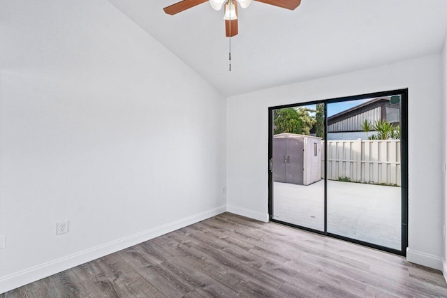 empty room featuring vaulted ceiling, ceiling fan, and light hardwood / wood-style flooring