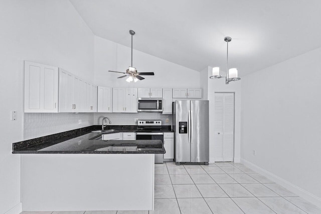 kitchen with pendant lighting, sink, white cabinets, backsplash, and stainless steel appliances