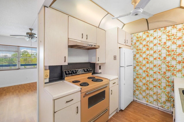 kitchen featuring ceiling fan, white appliances, a textured ceiling, white cabinetry, and light wood-type flooring