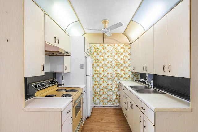 kitchen featuring ceiling fan, sink, white appliances, white cabinetry, and light hardwood / wood-style floors