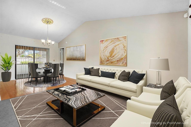 living area with dark wood-type flooring, lofted ceiling, and a notable chandelier