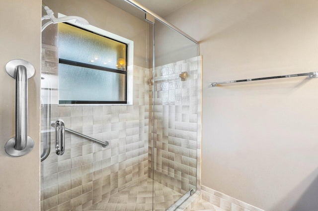 full bathroom with a shower stall