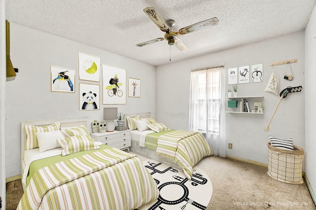 bedroom with a textured ceiling, ceiling fan, baseboards, and light colored carpet