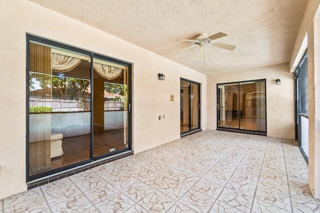 view of patio featuring ceiling fan