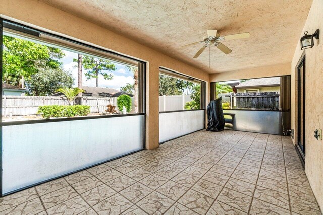 view of swimming pool with a patio and a storage unit