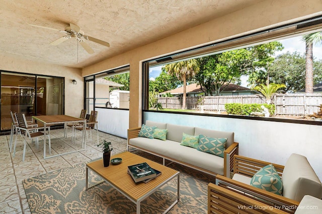 sunroom / solarium with ceiling fan